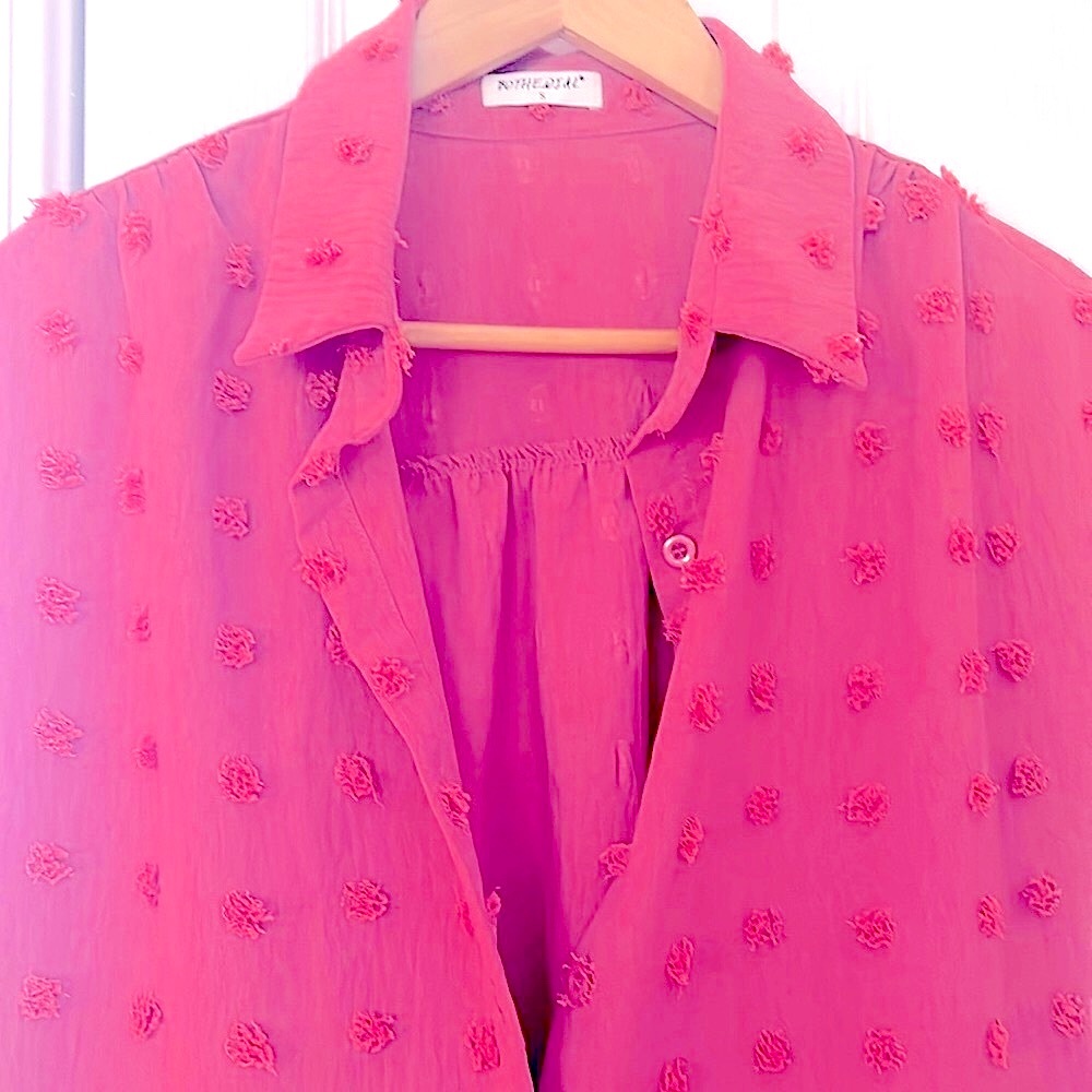 Woman’s short sleeve shirt blouse fits on the looser side